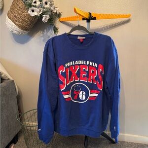 Mitchell & Ness Philadelphia 76ers Blue Crewneck for men or women.